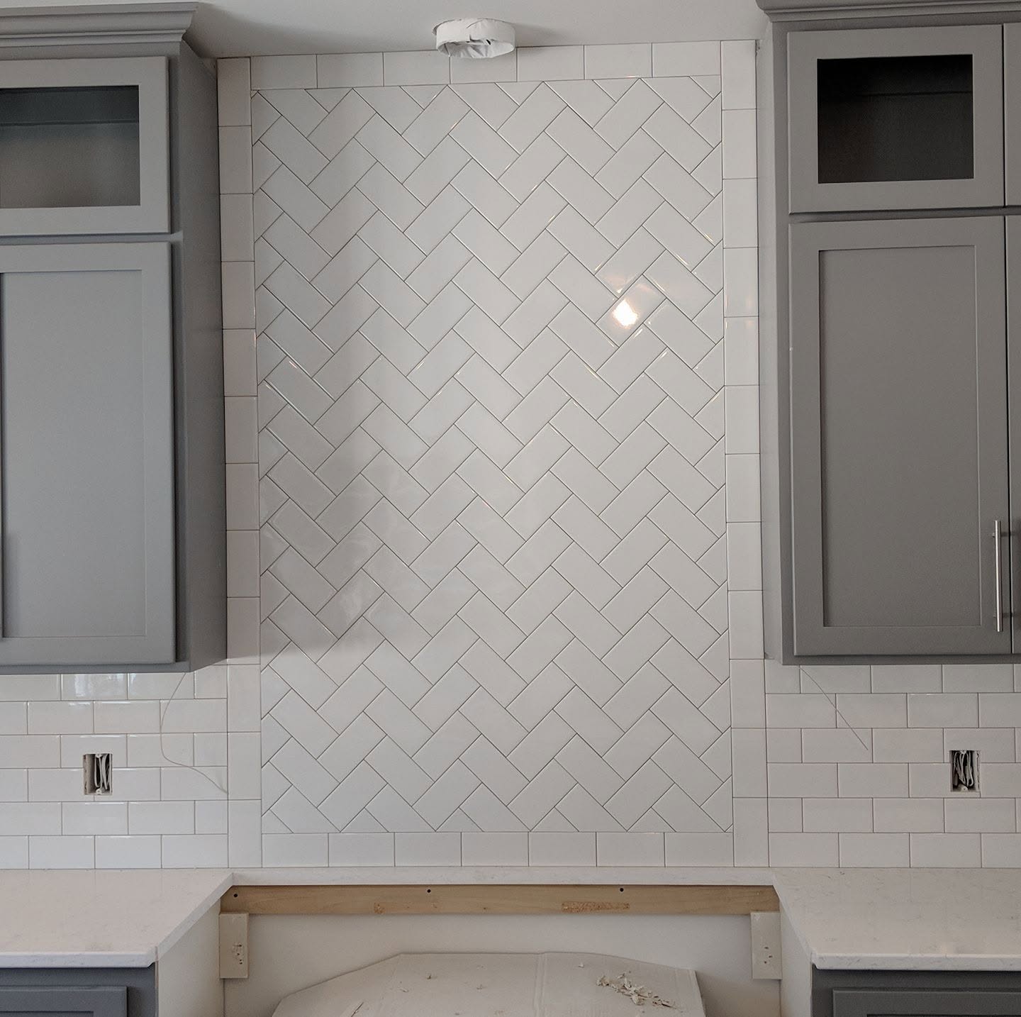 Herringbone tile backsplash accent wall