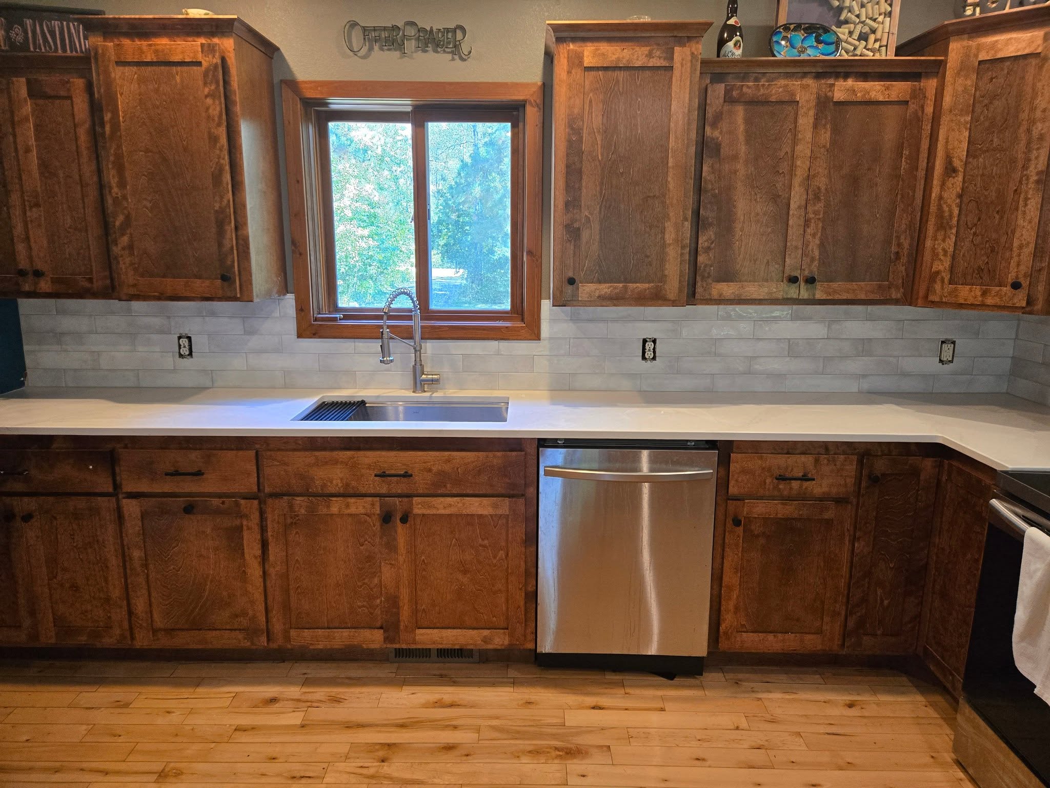 Kitchen with subway tile backsplash and wood cabinets